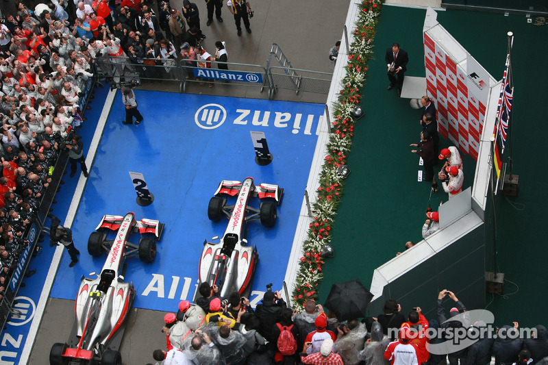 Podium: race winner Jenson Button, McLaren Mercedes, with second place Lewis Hamilton, McLaren Merce