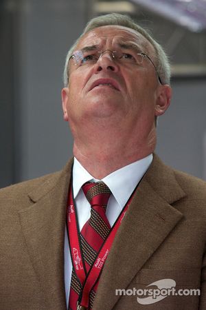 VAG Chaiman of the Board Martin Winterkorn watches the end of the race while the last Peugeot 908 on track retires