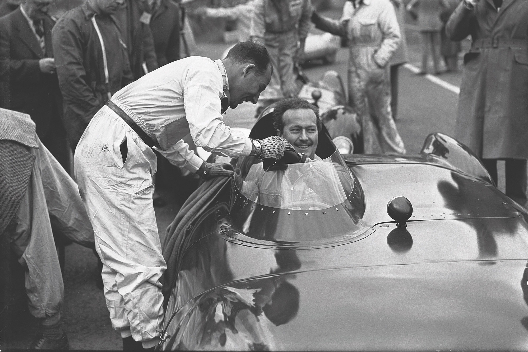 Colin Chapman (seen here with Stirling Moss) was a capable racing driver