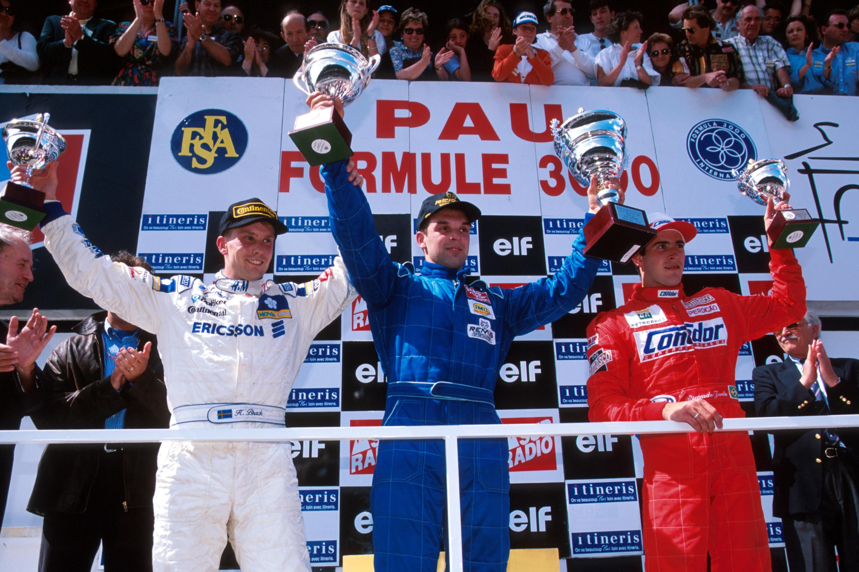 Jorg Muller flanked on the podium after winning the 1996 Pau F3000 race by Kenny Brack and Ricardo Zonta
