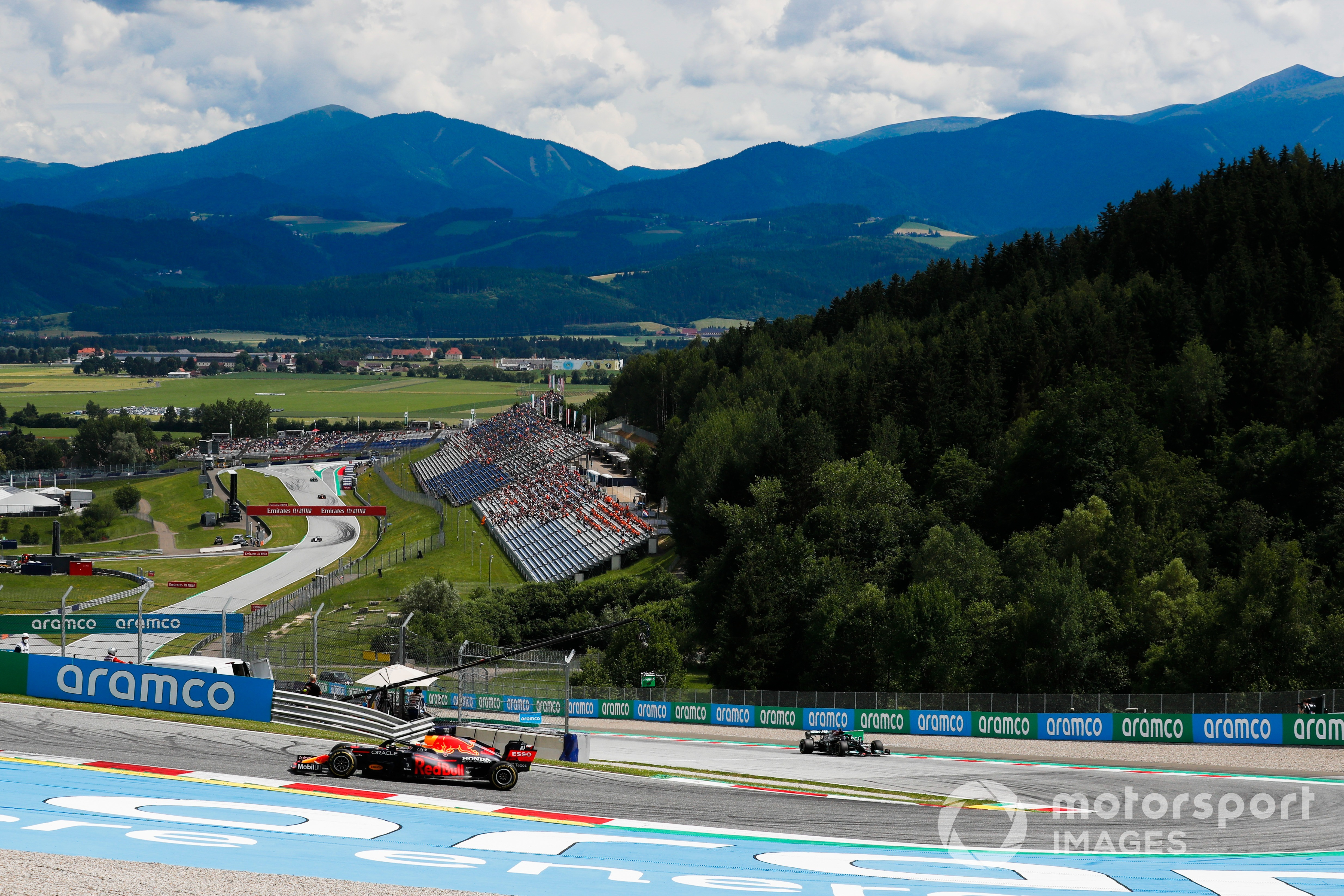 Max Verstappen, Red Bull Racing RB16B, leads Lewis Hamilton, Mercedes W12