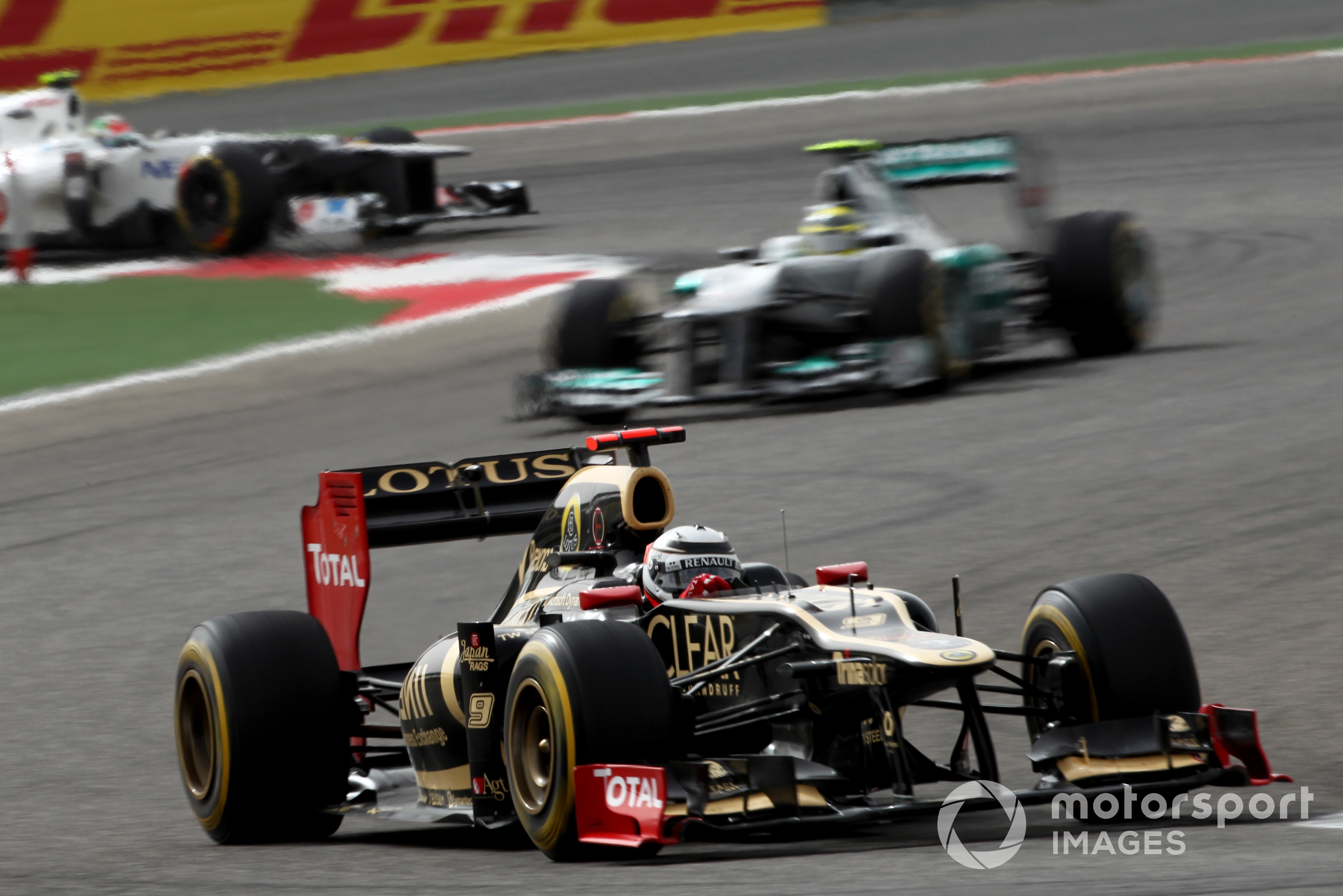 Kimi Raikkonen, Lotus E20 Renault, leads Nico Rosberg, Mercedes F1 W03, 2012 Bahrain GP