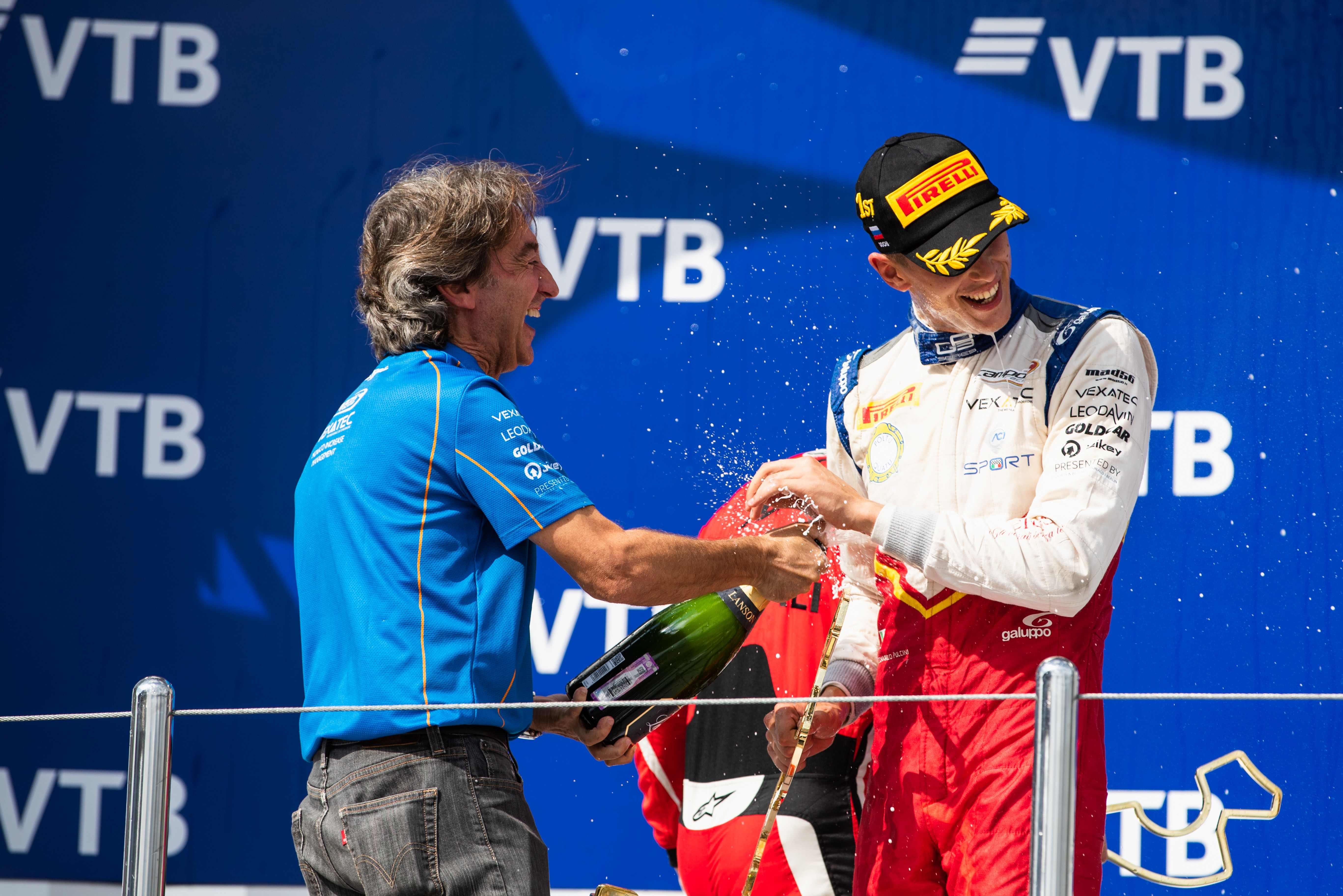 Campos celebrates on the podium with Leonardo Pulcini after the Italian's GP3 feature race victory in 2018