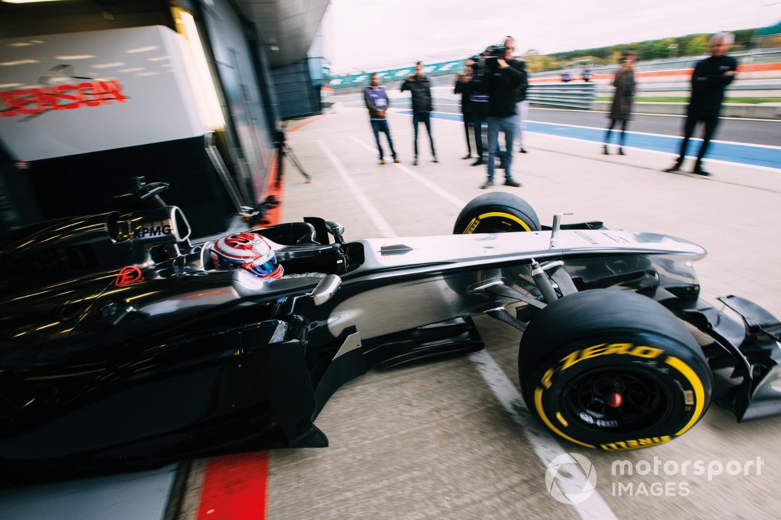 At the wheel of Jenson Button's McLaren MP4-26, Russell got his first taste of F1 machinery