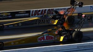 Leah Pritchett pilots the Papa John's TF dragster past Tony Schumacher, Feb. 12